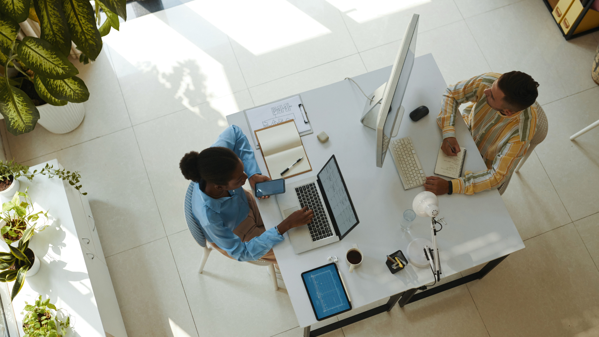 Illustration of a diverse group of employees brainstorming and creating blog content together, symbolizing team-wide involvement in corporate blogging.